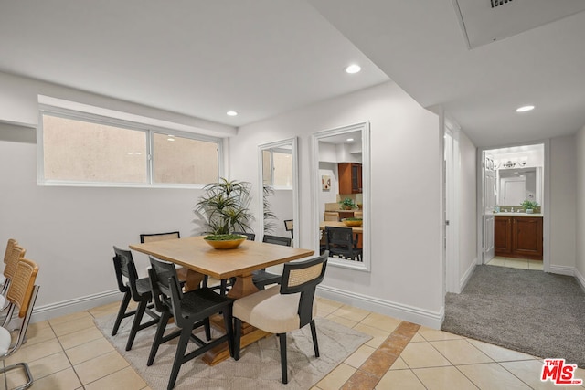 dining area featuring light tile patterned floors