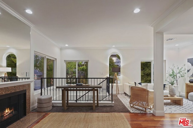 interior space with crown molding and hardwood / wood-style flooring