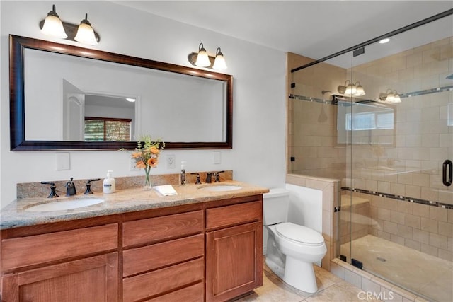 bathroom with toilet, tile patterned flooring, a shower with shower door, and vanity