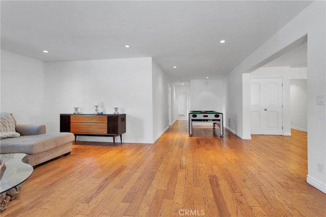 living room with light hardwood / wood-style flooring