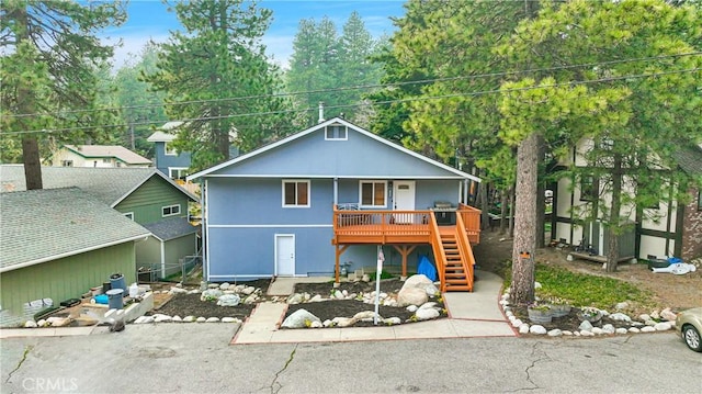 view of front of property featuring a wooden deck