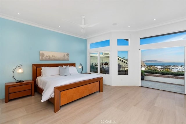 bedroom featuring ceiling fan, a water view, crown molding, and access to outside