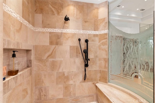 bathroom featuring tiled shower