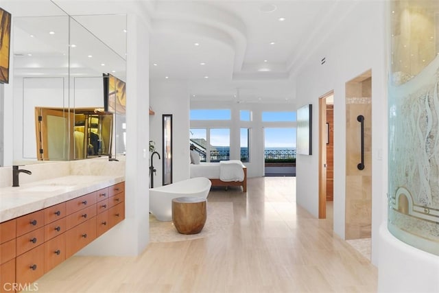 bathroom with vanity and separate shower and tub