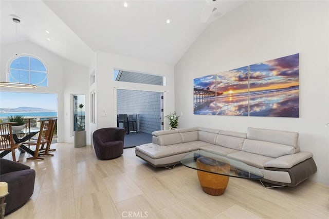 living room with high vaulted ceiling