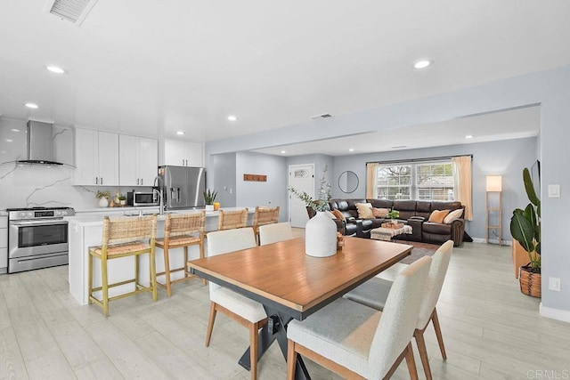 dining area featuring light hardwood / wood-style flooring