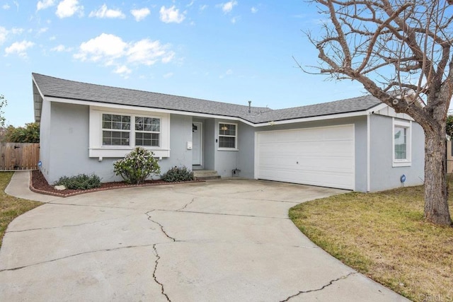 single story home with a garage and a front lawn