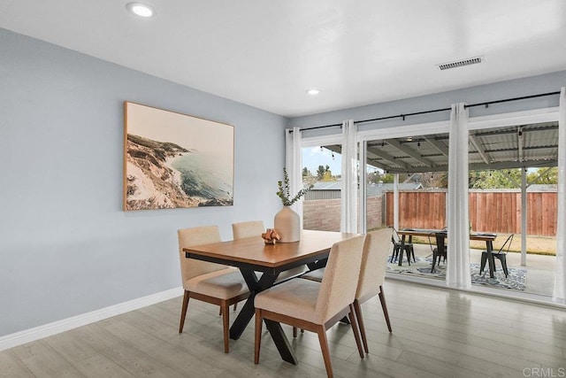 dining room featuring wood-type flooring