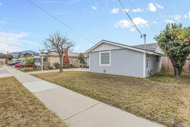 view of property exterior featuring a lawn