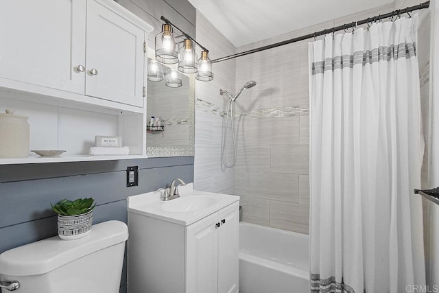 full bathroom with vanity, shower / bath combination with curtain, and toilet