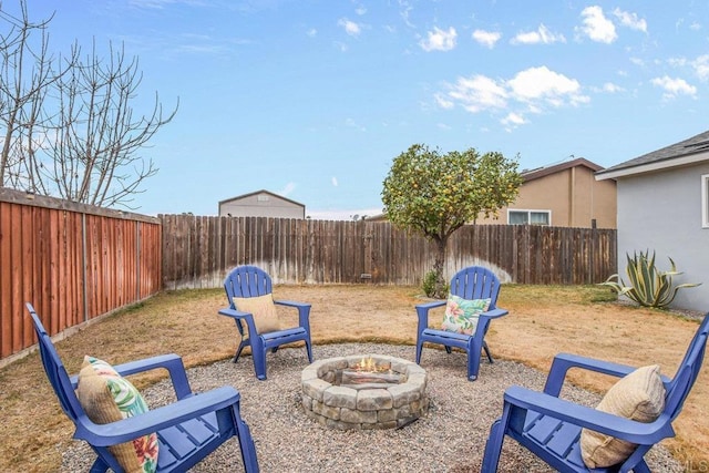 view of yard with an outdoor fire pit