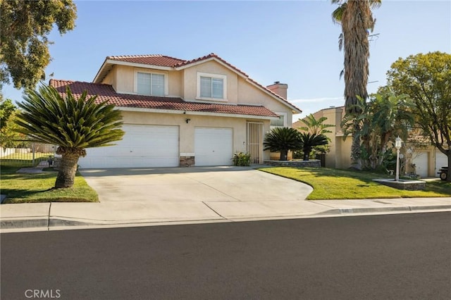 view of front of house featuring a front yard and a garage