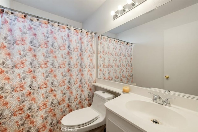 bathroom with vanity and toilet