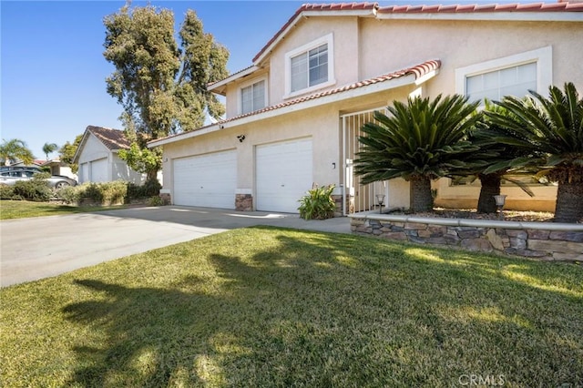 view of front facade featuring a garage and a front yard