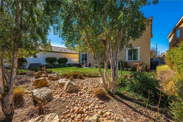 view of front of home with a front yard