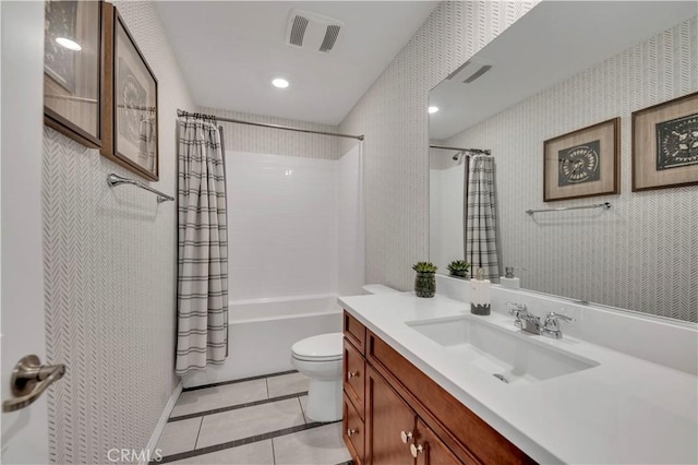 full bathroom with tile patterned floors, vanity, toilet, and shower / bath combination with curtain