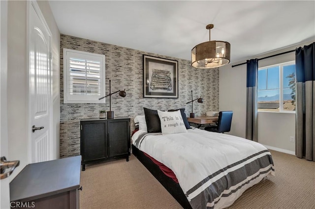 carpeted bedroom with multiple windows