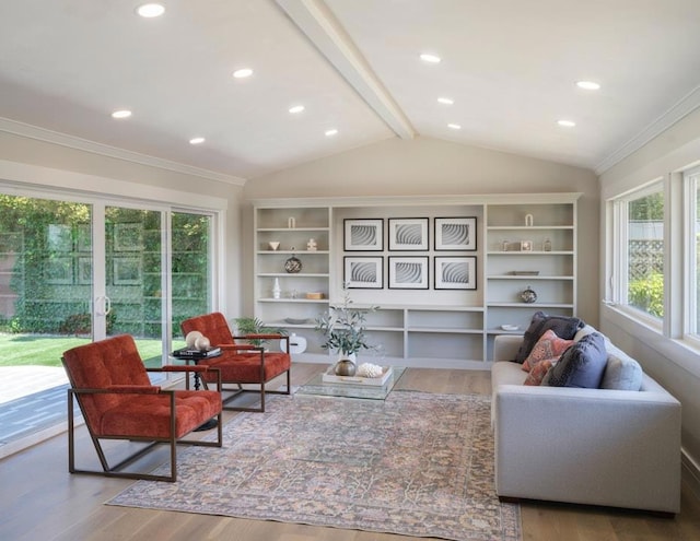 living area featuring hardwood / wood-style floors and lofted ceiling with beams