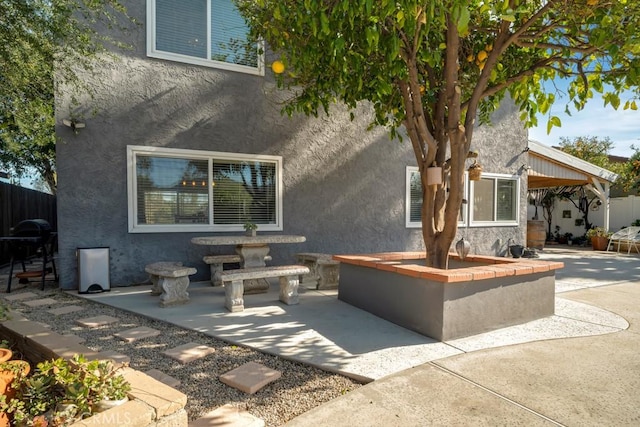 back of house with a patio area