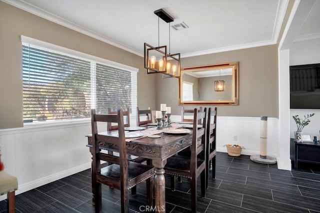 dining space with crown molding