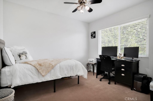 bedroom featuring light carpet and ceiling fan