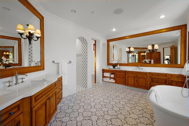 bathroom with crown molding, a chandelier, vanity, and shower with separate bathtub