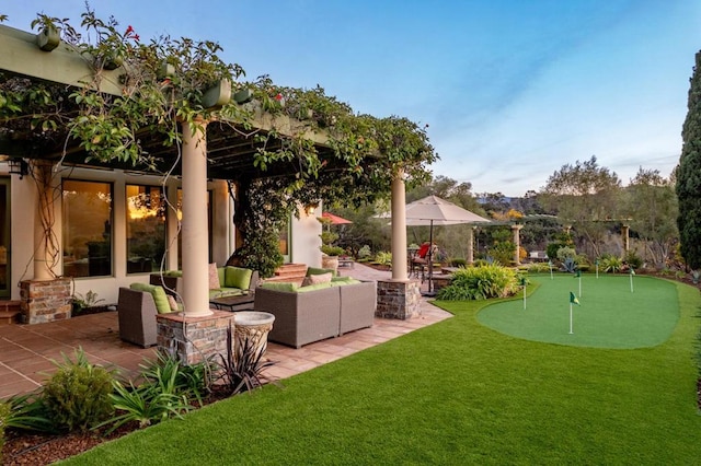 view of yard with an outdoor living space and a patio