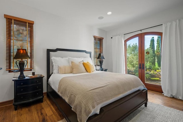 bedroom featuring hardwood / wood-style floors and french doors