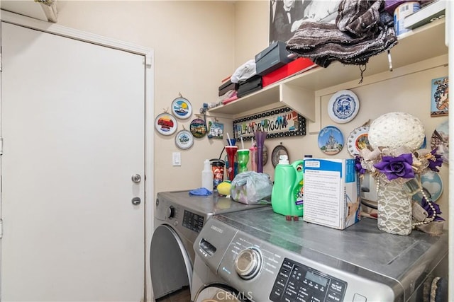 clothes washing area featuring separate washer and dryer