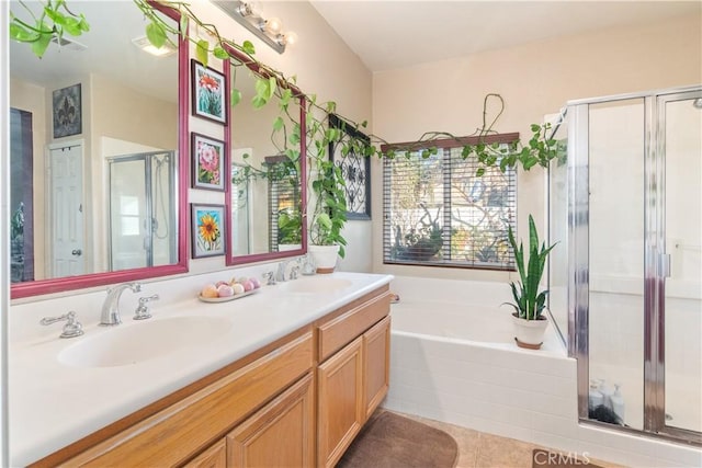 bathroom with independent shower and bath, vanity, and tile patterned flooring