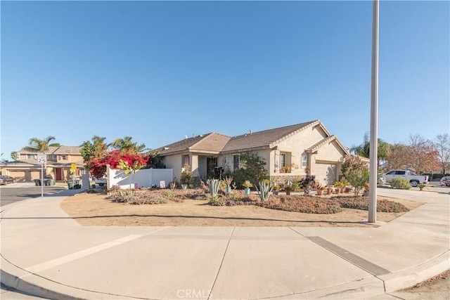 ranch-style home featuring a garage