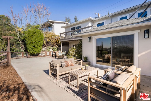 view of patio / terrace featuring a balcony and outdoor lounge area