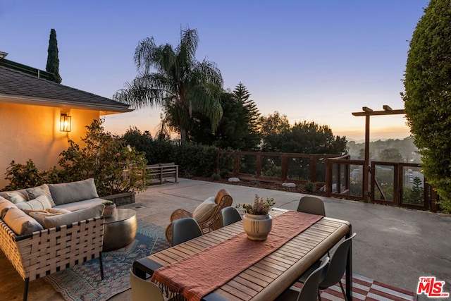 patio terrace at dusk with an outdoor hangout area