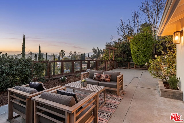 patio terrace at dusk with an outdoor living space