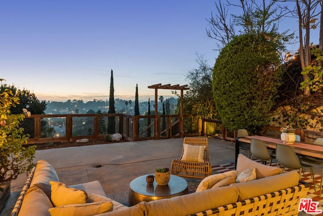 patio terrace at dusk with an outdoor hangout area