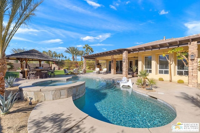 view of pool featuring an in ground hot tub, a patio area, a gazebo, and a bar