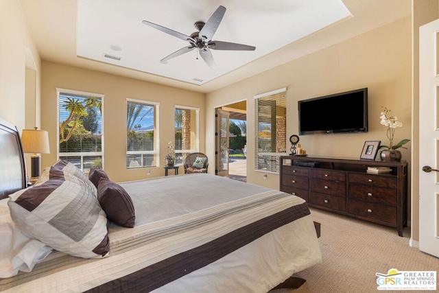 bedroom featuring ceiling fan, light colored carpet, and access to exterior