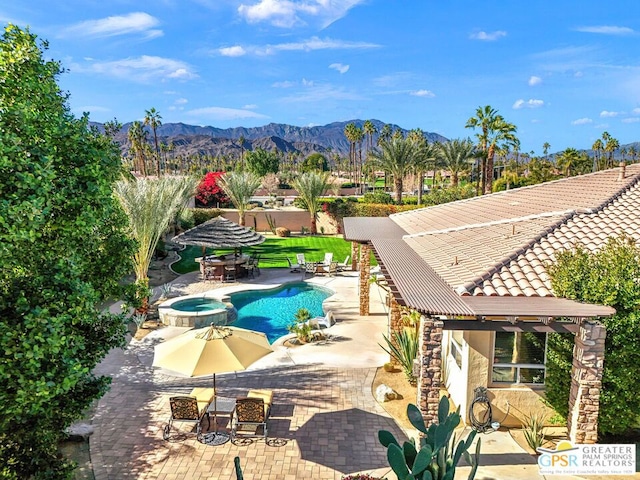 view of pool featuring a mountain view, an in ground hot tub, a patio, and a pergola