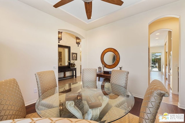 dining space featuring ceiling fan and wood-type flooring