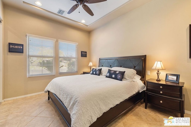 tiled bedroom with ceiling fan