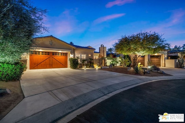 mediterranean / spanish-style home featuring a garage