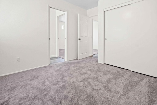 unfurnished room with light carpet