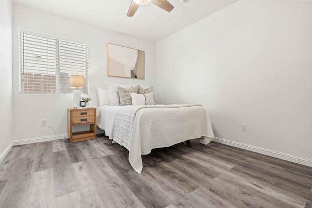 bedroom featuring ceiling fan and hardwood / wood-style floors