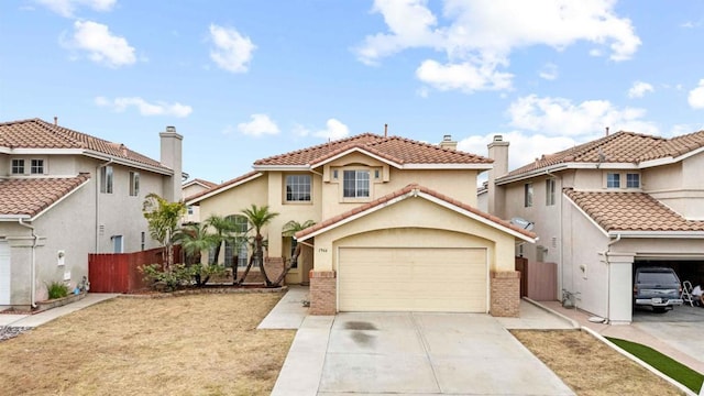 mediterranean / spanish house with a garage