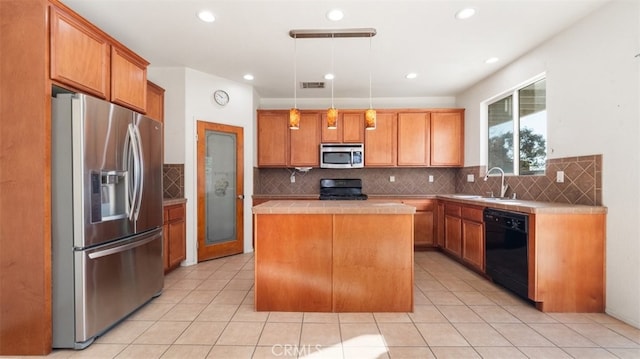 kitchen featuring sink, a kitchen island, pendant lighting, backsplash, and stainless steel appliances