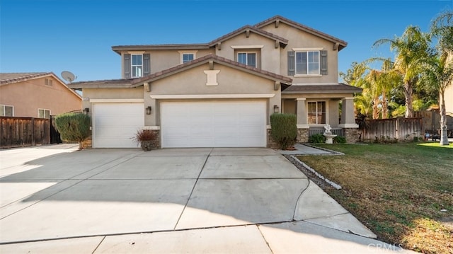 view of front of home with a front yard and a garage