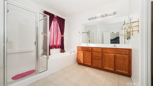 bathroom with tile patterned floors, vanity, and independent shower and bath