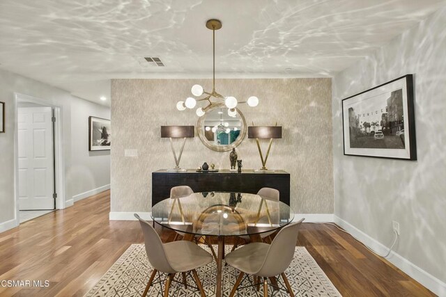 dining room with hardwood / wood-style flooring