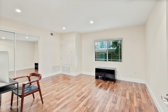 sitting room featuring light hardwood / wood-style flooring