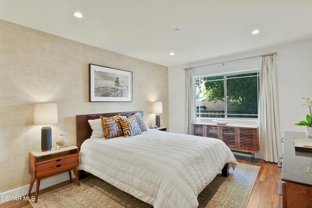 bedroom with wood-type flooring